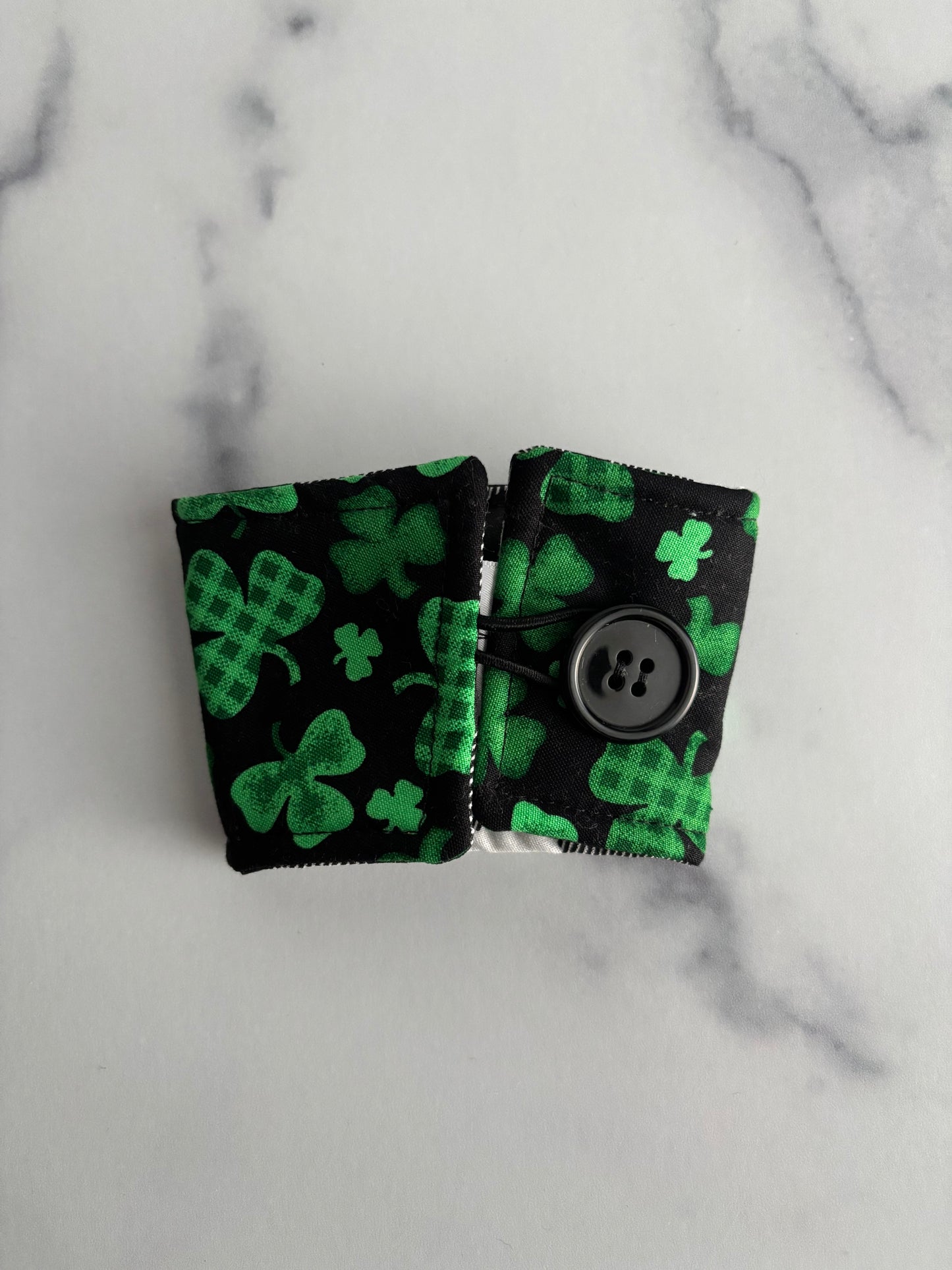 Clovers on Black - Reusable Coffee Sleeve