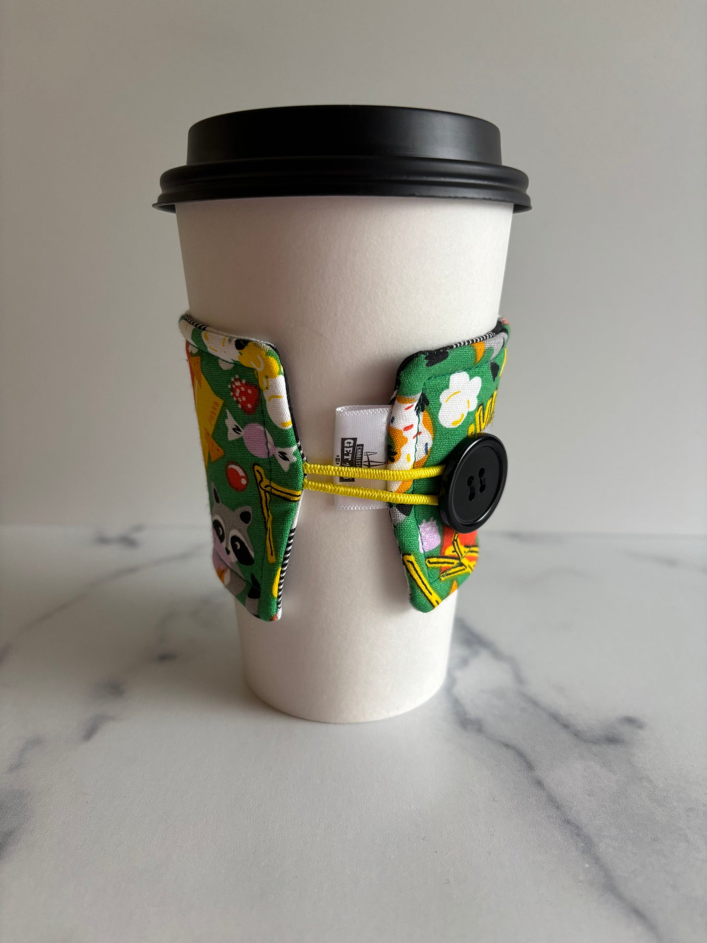 Raccoons on Green - Reusable Coffee Sleeve