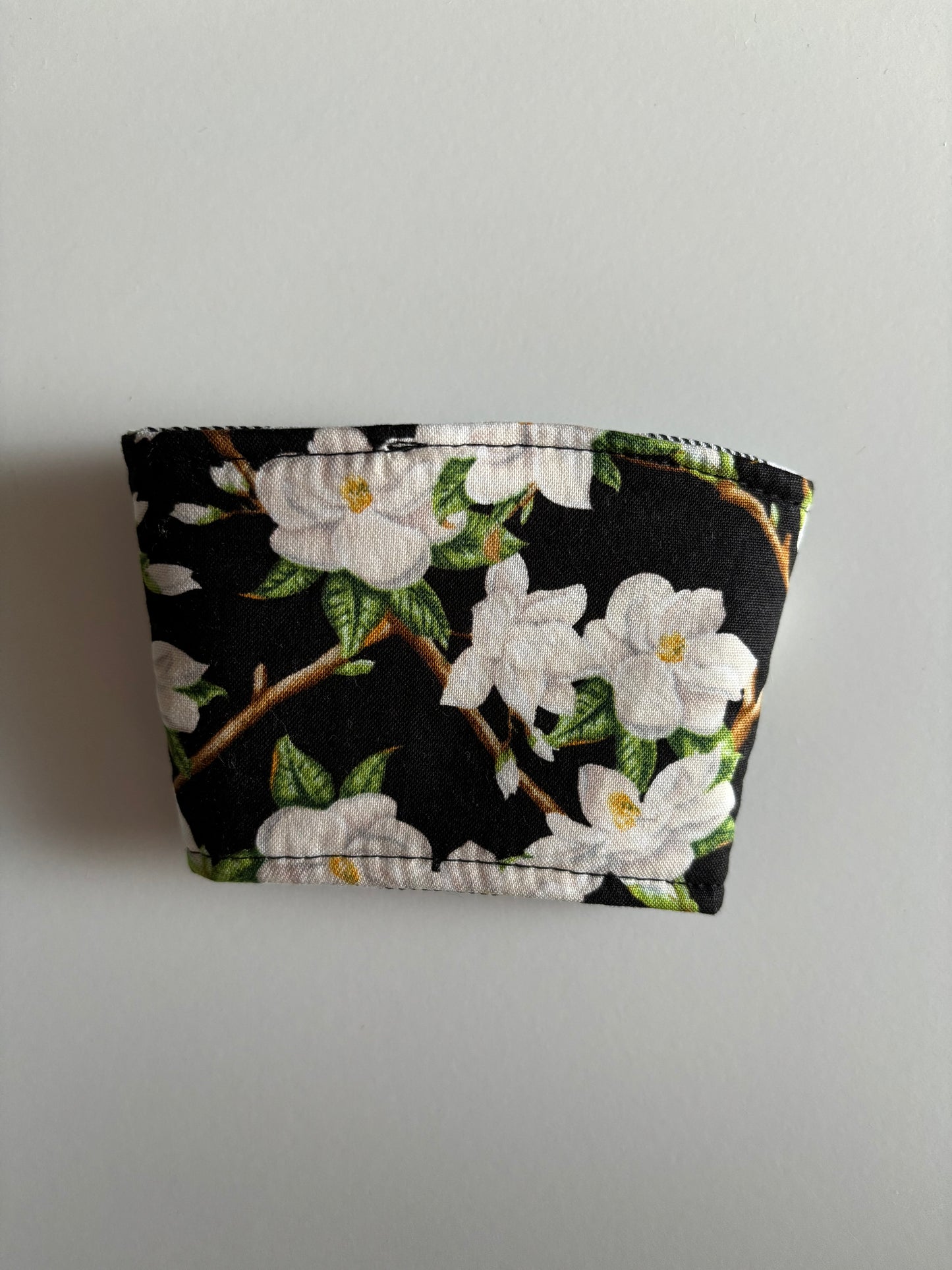 Magnolias on Black - Reusable Coffee Sleeve