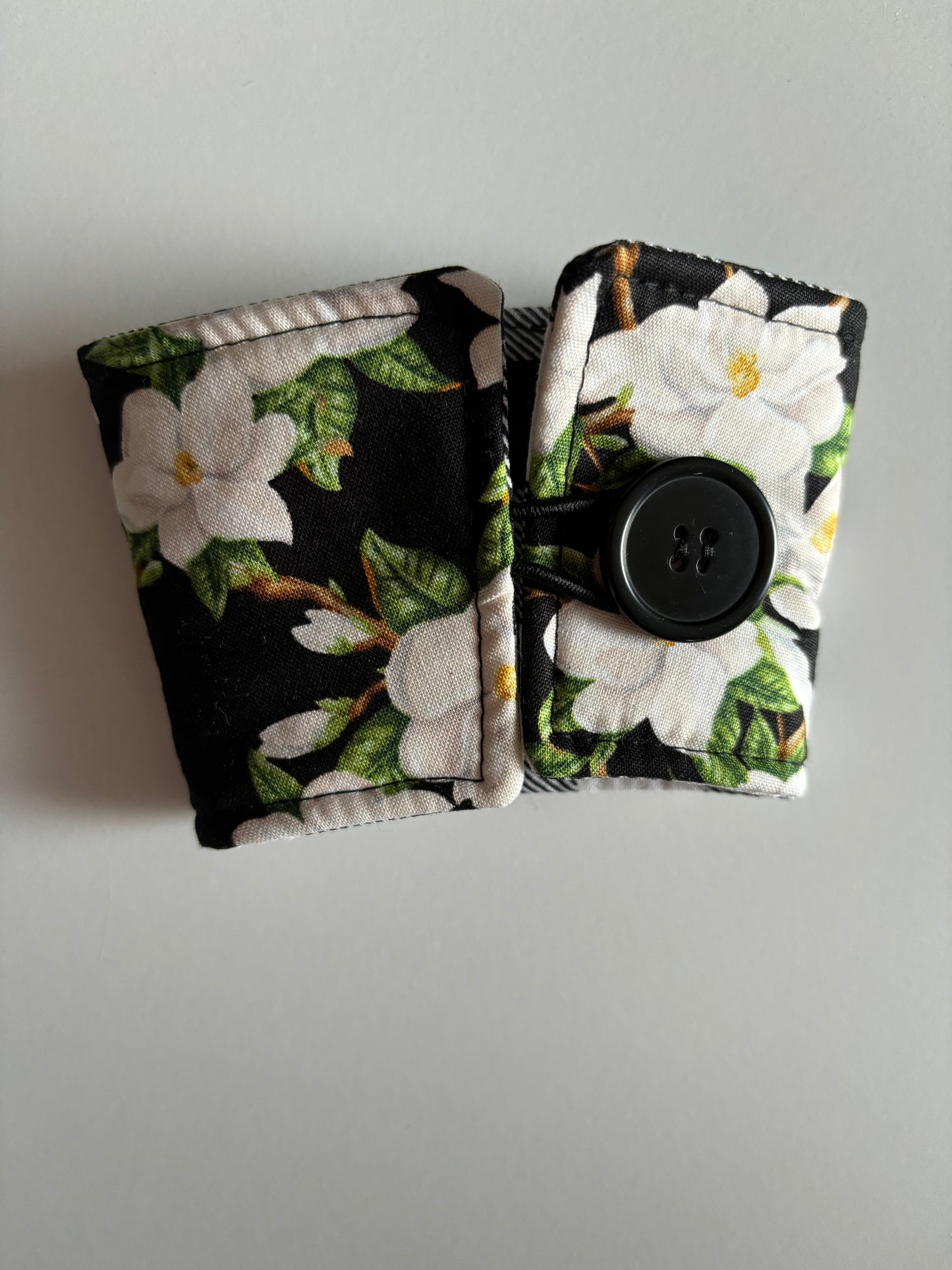 Magnolias on Black - Reusable Coffee Sleeve