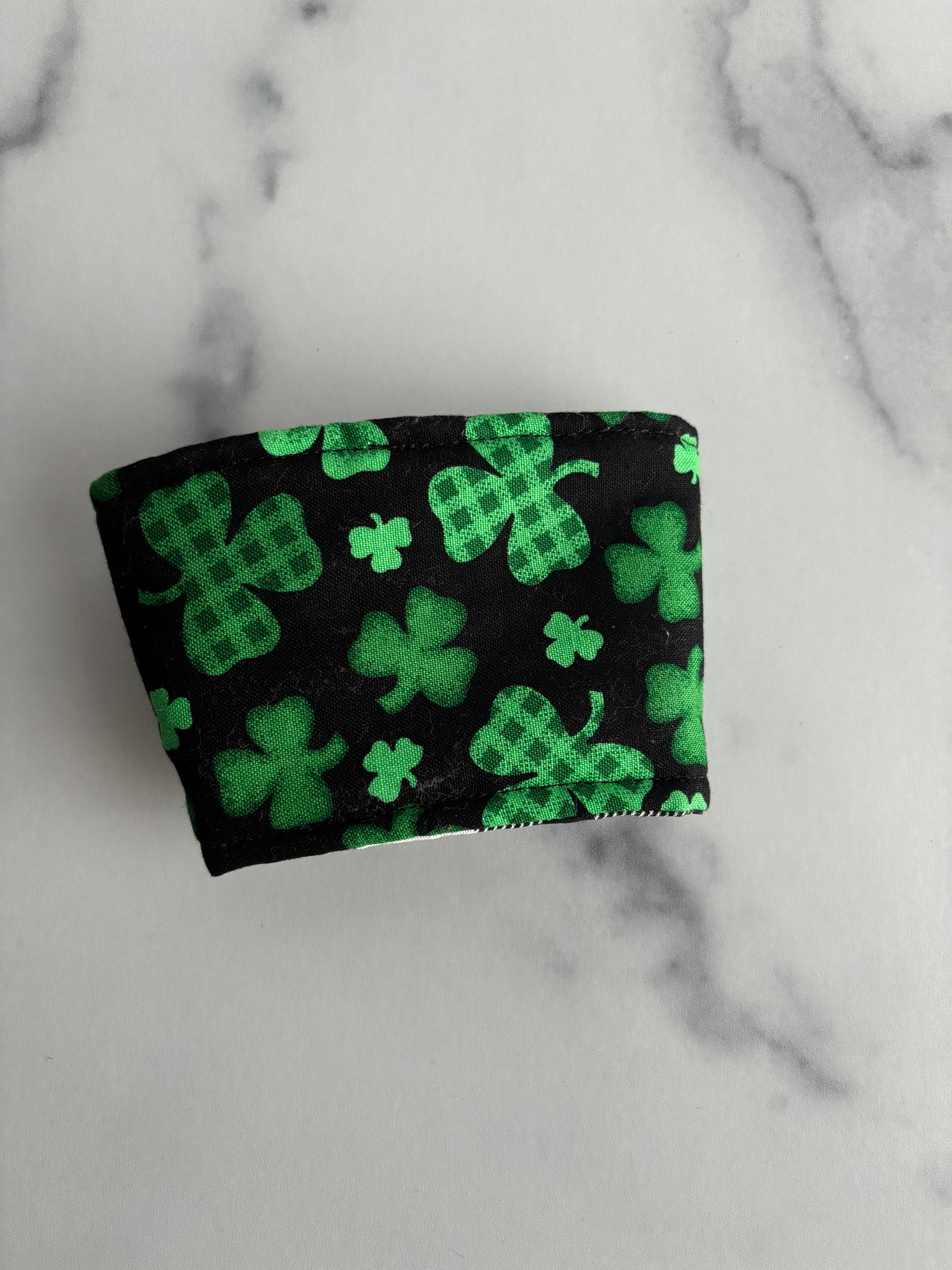 Clovers on Black - Reusable Coffee Sleeve