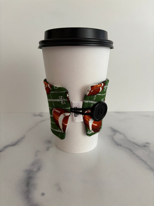 Footballs on Green - Reusable Coffee Sleeve