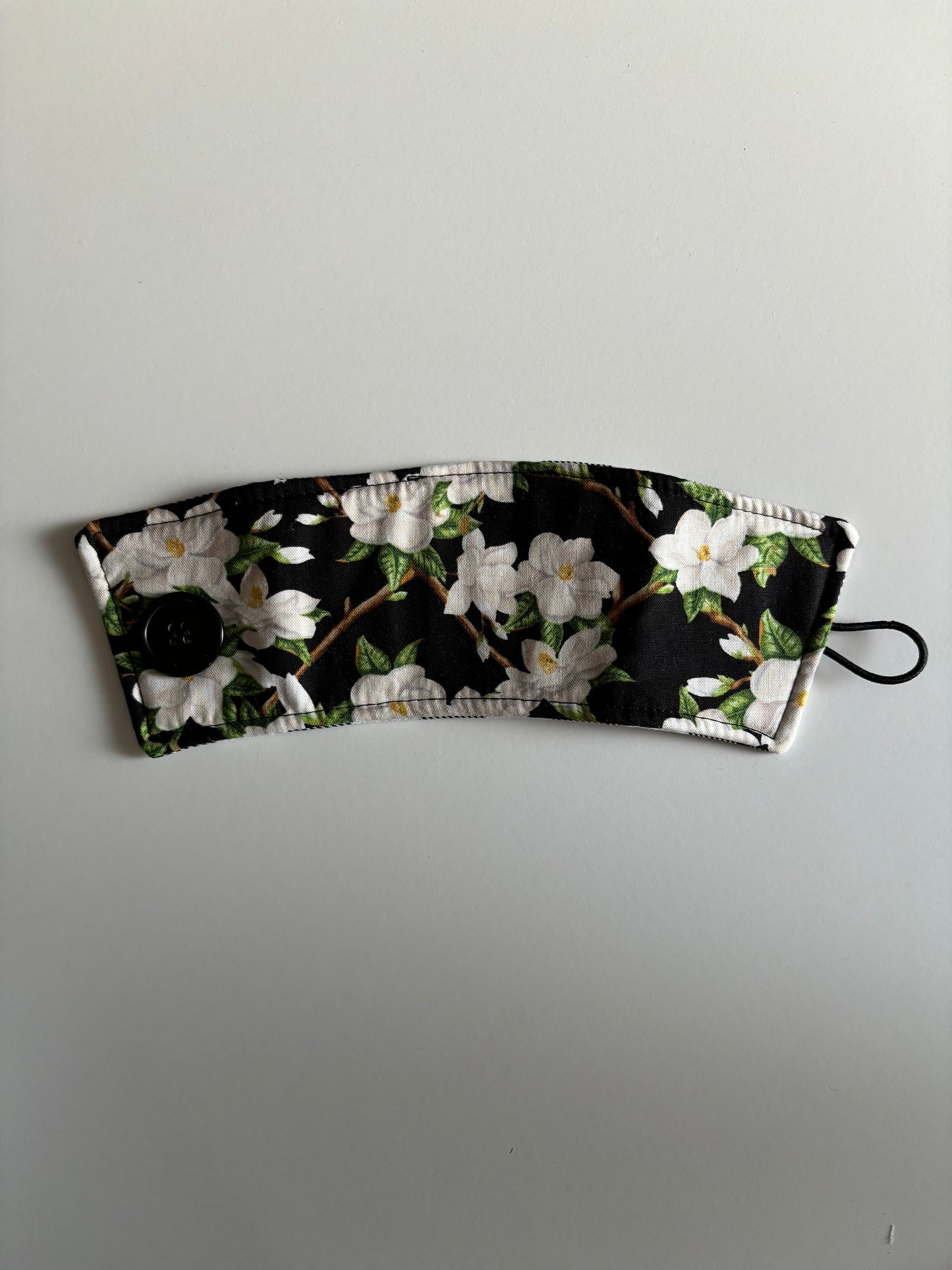 Magnolias on Black - Reusable Coffee Sleeve