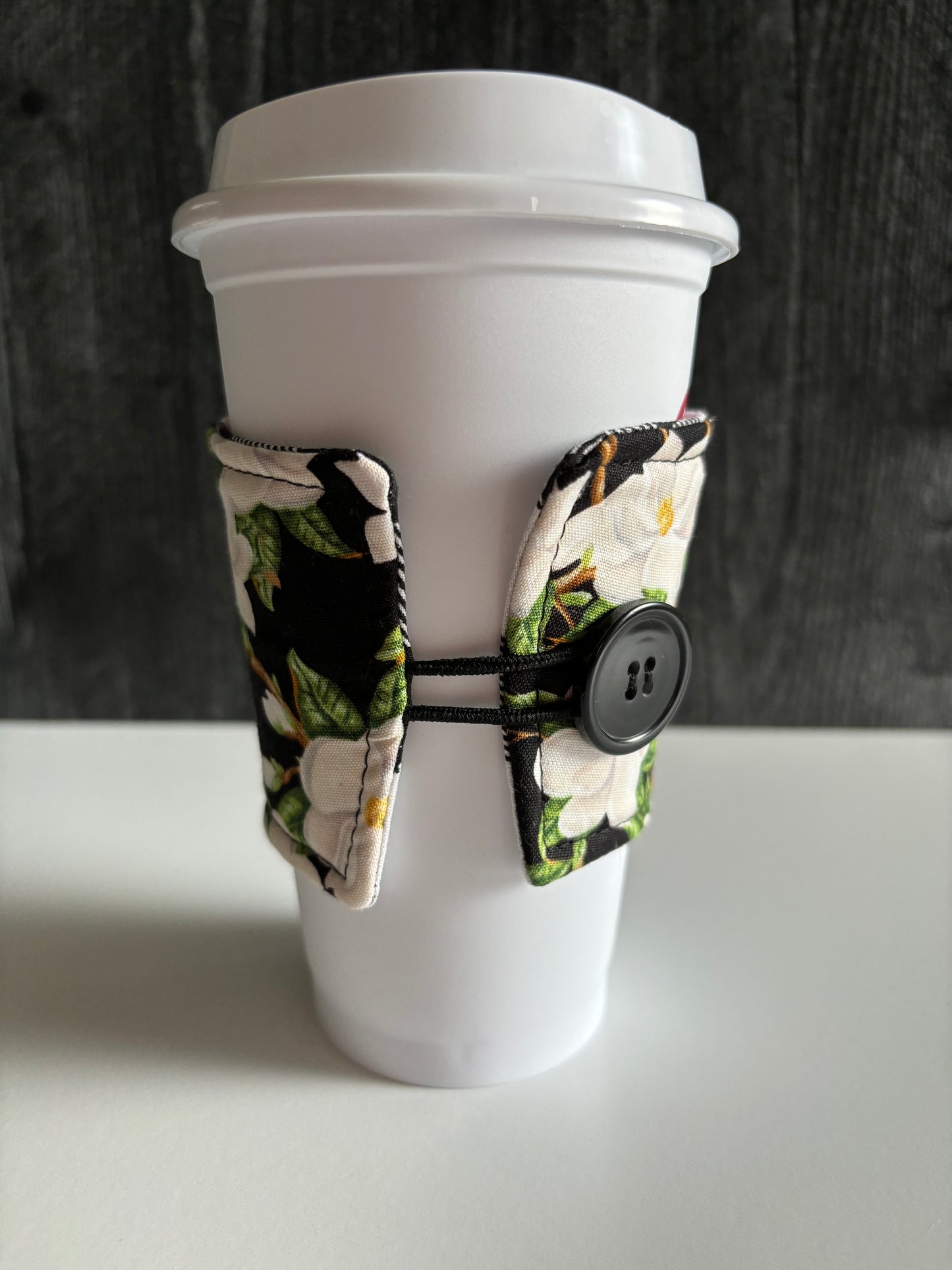 Magnolias on Black - Reusable Coffee Sleeve